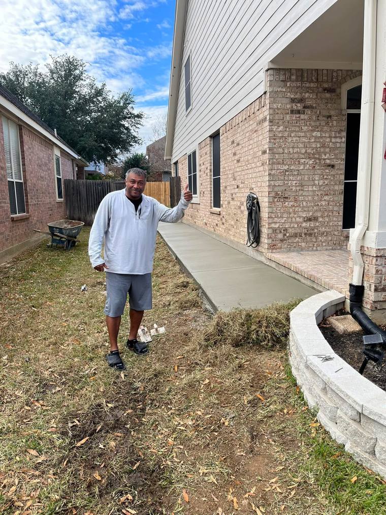 Concrete walkway alongside home