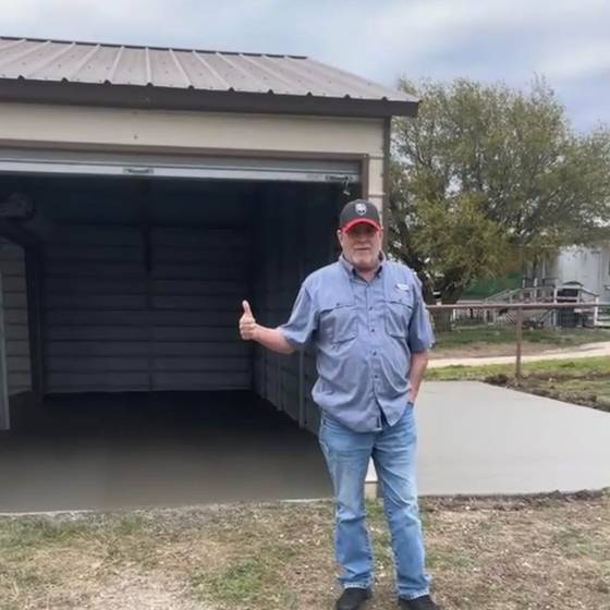 Satisfied customer with garage approach slab