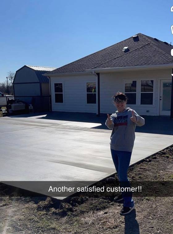 Satisfied customer with new concrete driveway