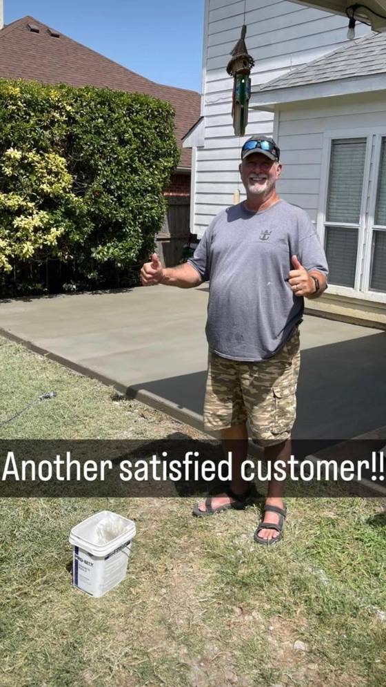 Satisfied customer with new concrete patio